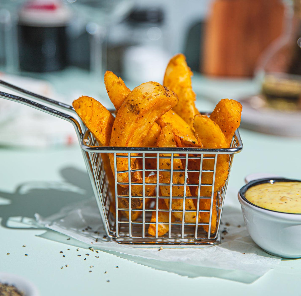 Thick-Cut Steak Fries with Garlic Aioli - WECO Hospitality